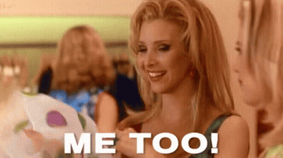 A Woman Is Smiling And Holding A Piece Of Paper With The Words Me Too Written On It . GIF