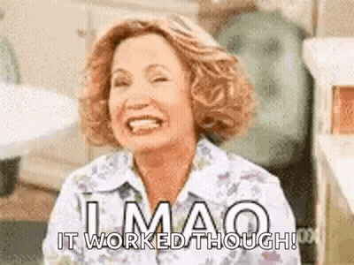 A Woman Is Smiling And Laughing With The Words `` It Worked Though '' Written Below Her . GIF