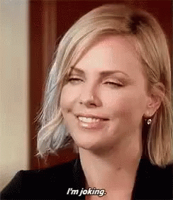 A Woman Is Smiling And Saying `` I 'M Joking . '' GIF