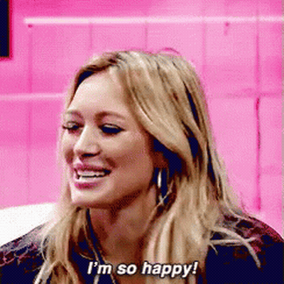 A Woman Is Smiling And Saying I 'M So Happy ! GIF