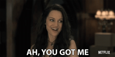 A Woman Is Smiling And Says Ah You Got Me Netflix GIF