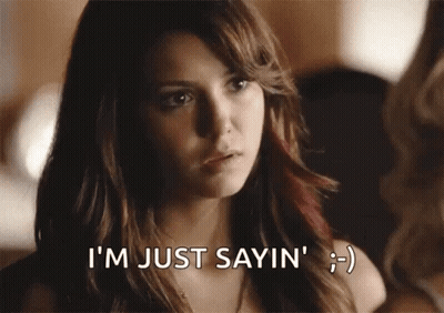 A Woman Is Smiling And Says I 'M Just Sayin ' . GIF