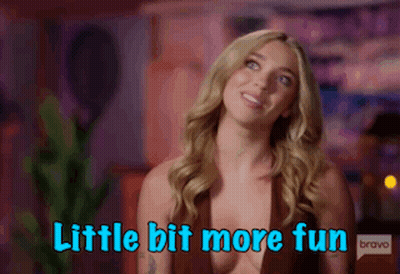 A Woman Is Smiling And Says Little Bit More Fun Bravo GIF