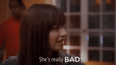 A Woman Is Smiling And Says `` She 'S Really Bad '' . GIF