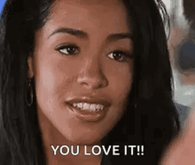 A Woman Is Smiling And Says `` You Love It '' . GIF