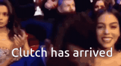 A Woman Is Smiling In Front Of A Crowd With The Words " Clutch Has Arrived " GIF