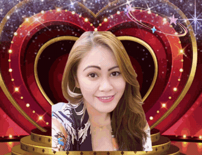 A Woman Is Smiling In Front Of A Heart Shaped Frame GIF