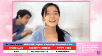 A Woman Is Smiling In Front Of A Man And A Sign That Says Account Name Abs-Cbn Lingkod Kapamilya Foundation Inc GIF