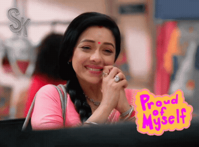 A Woman Is Smiling In Front Of A Sign That Reads Proud Of Myself GIF