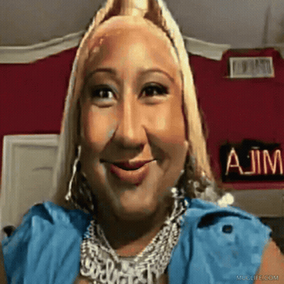 A Woman Is Smiling In Front Of A Sign That Says A Jim GIF