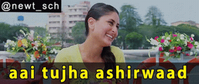 A Woman Is Smiling In Front Of A Sign That Says Aai Tujha Ashirwaad GIF