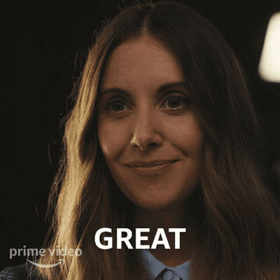 A Woman Is Smiling In Front Of A Sign That Says " Great " GIF