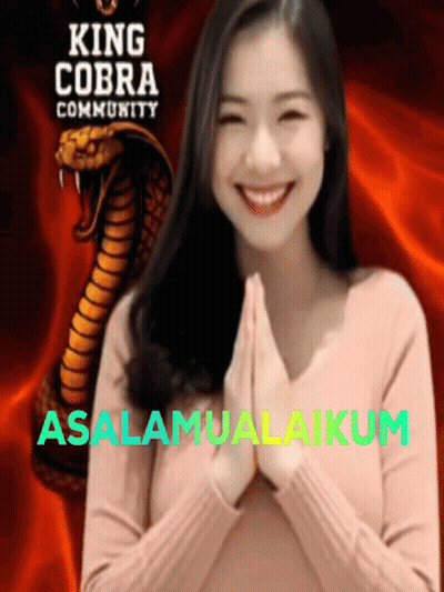 A Woman Is Smiling In Front Of King Cobra Community GIF