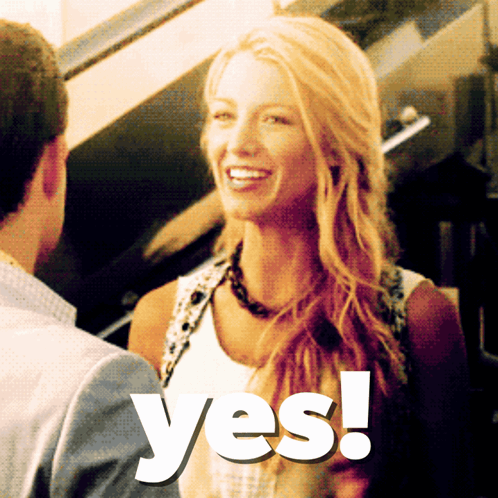 A Woman Is Smiling Next To A Man And The Word Yes Is Visible GIF