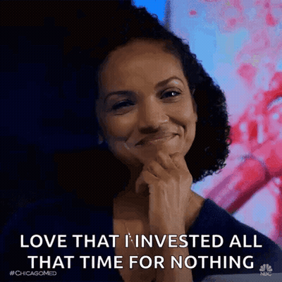 A Woman Is Smiling While Holding Her Hand To Her Chin And Saying `` Love That I Invested All That Time For Nothing '' . GIF
