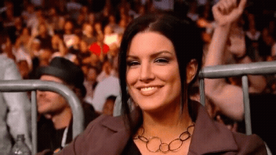 Woman Smiling At Boxing Match GIF