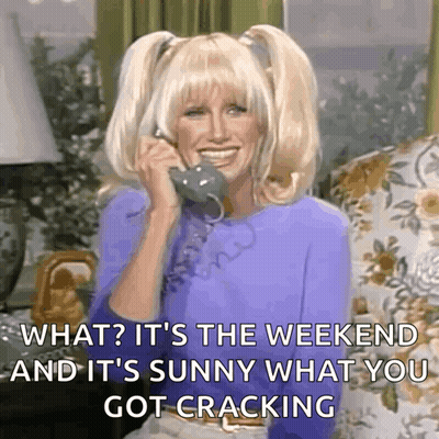 A Woman Is Smiling While Talking On A Phone And Says What It 'S The Weekend And It 'S Sunny GIF