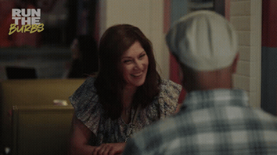 A Woman Is Smiling While Talking To A Man And The Words You 'Re So Funny GIF