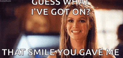 A Woman Is Smiling With A Meme That Says `` Guess What I 'Ve Got On ? That Smile You Gave Me '' GIF