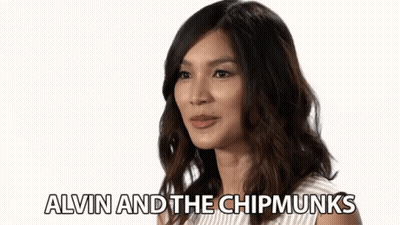 A Woman Is Smiling With The Words Alvin And The Chipmunks Written Below Her GIF