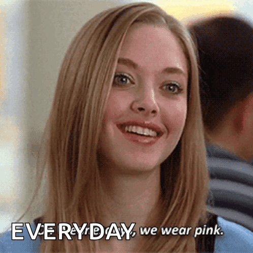 A Woman Is Smiling With The Words " Everyday We Wear Pink " Above Her GIF