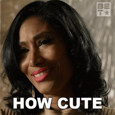 A Woman Is Smiling With The Words How Cute Written Below Her GIF