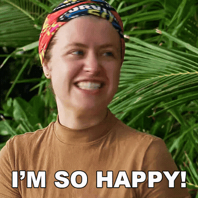 A Woman Is Smiling With The Words I 'M So Happy Written Below Her GIF