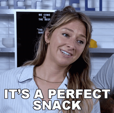 A Woman Is Smiling With The Words " It 'S A Perfect Snack " Below Her GIF