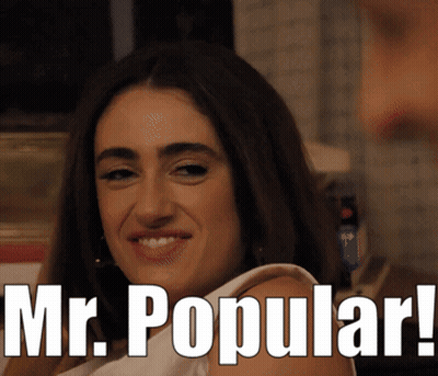 A Woman Is Smiling With The Words " Mr. Popular " Above Her GIF