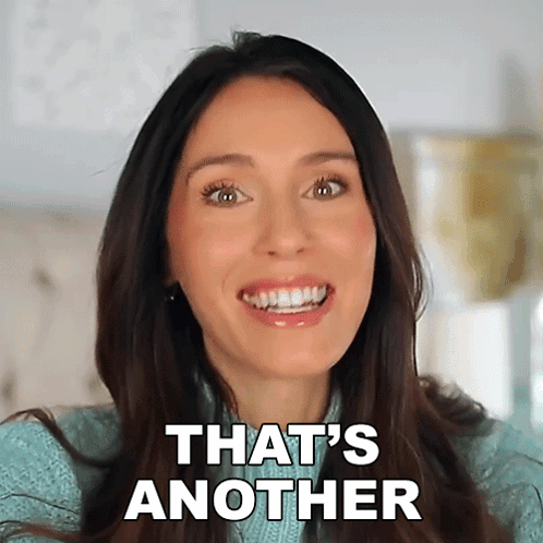 A Woman Is Smiling With The Words That 'S Another On Her Face GIF