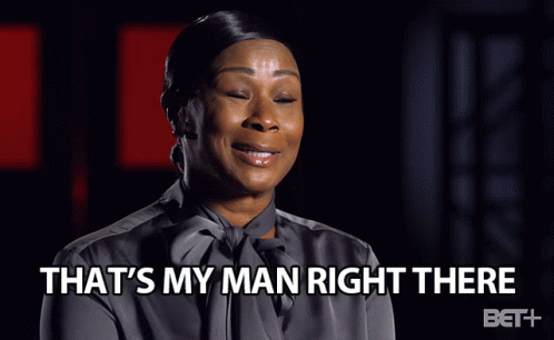 A Woman Is Smiling With The Words That 'S My Man Right There Beneath Her GIF