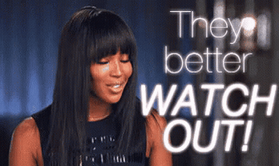 A Woman Is Smiling With The Words " They Better Watch Out " Behind Her GIF