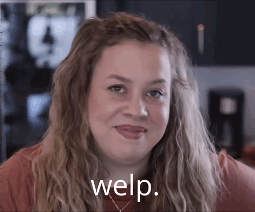 A Woman Is Smiling With Welp Written On The Bottom Of Her Face GIF