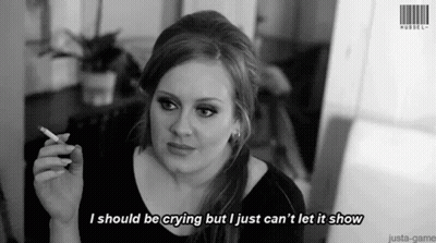 A Woman Is Smoking A Cigarette And Says I Should Be Crying But I Just Can 'T Let It Show . GIF