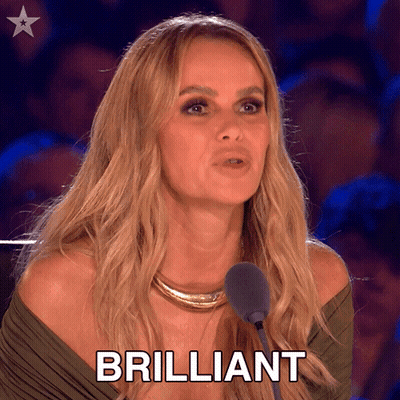 A Woman Is Speaking Into A Microphone And The Word Brilliant Is On The Screen Behind Her GIF