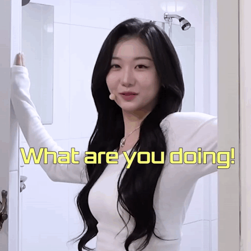 A Woman Is Standing In A Bathroom With The Words What Are You Doing On The Bottom GIF