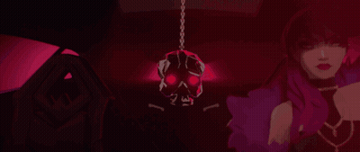 A Woman Is Standing In A Dark Room With A Skull Hanging From The Ceiling GIF