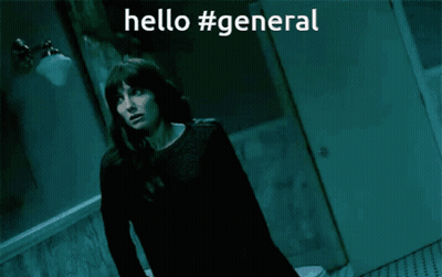 A Woman Is Standing In A Dark Room With The Words Hello #General Written Above Her GIF
