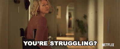 A Woman Is Standing In A Hallway And Says You 'Re Struggling GIF