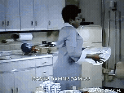 A Woman Is Standing In A Kitchen Holding A Piece Of Paper That Says Damn Damn Damn Damn . GIF