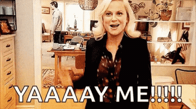 A Woman Is Standing In A Living Room With A Man Standing Behind Her And A Man Standing In The Background . GIF