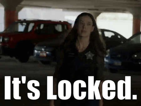 A Woman Is Standing In A Parking Garage With The Words It 'S Locked Behind Her GIF