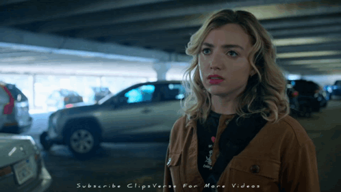 A Woman Is Standing In A Parking Garage With The Words Subscribe Clipsverse For More Videos Written Below Her GIF