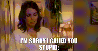 A Woman Is Standing In A Room And Says `` I 'M Sorry I Called You Stupid . '' GIF
