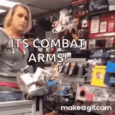 A Woman Is Standing In A Store Holding A Bag Of Groceries And A Sign That Says `` Its Combat Arms '' . GIF