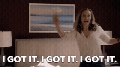 A Woman Is Standing In Front Of A Bed With Her Arms Outstretched And A Picture On The Wall . GIF