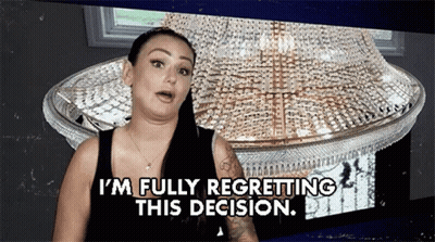 A Woman Is Standing In Front Of A Chandelier And Saying I 'M Fully Regretting This Decision GIF