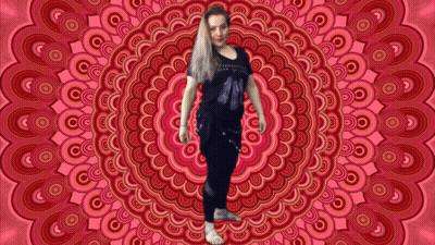 A Woman Is Standing In Front Of A Circular Pattern GIF