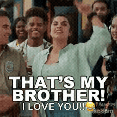 A Woman Is Standing In Front Of A Crowd Of People And Saying `` That 'S My Brother , I Love You ! '' GIF