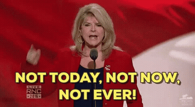 A Woman Is Standing In Front Of A Microphone And Saying `` Not Today , Not Now , Not Ever '' . GIF